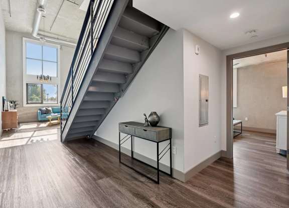 A modern interior with a staircase leading to the upper floor. at The Mansfield at Miracle Mile, Los Angeles