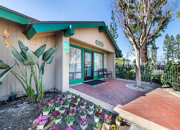 A small building with a green roof and a sign on it. at Heritage Park, Rialto, 92376