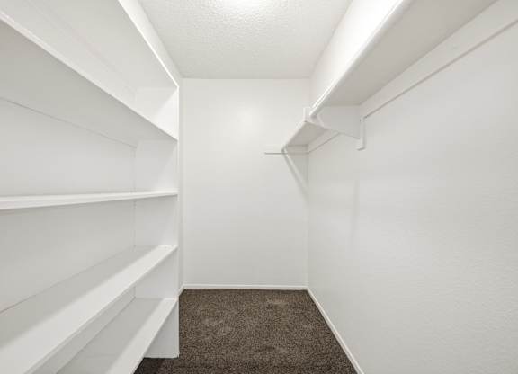 white shelves empty shelves A room with a carpeted floor and a window with blinds. at Heritage Park, Rialto, CA 92376
