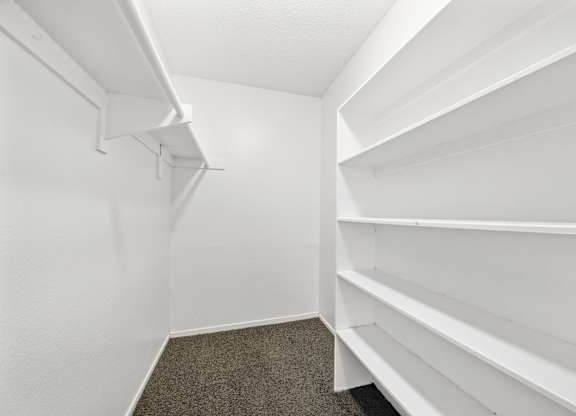 Empty white shelves in a room. at Heritage Park, California, 92376