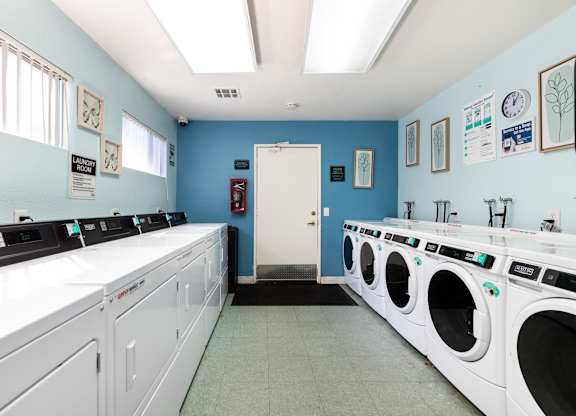 A row of washing machines in a laundromat. at Heritage Park, Rialto, CA