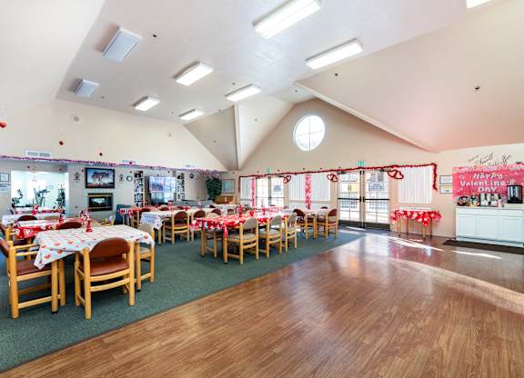 A room with tables set up for a party. at Whispering Fountains Diamond Bar, Diamond Bar, CA
