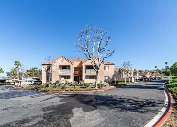 A large building with a tree in front of it. at Whispering Fountains Diamond Bar, Diamond Bar, CA