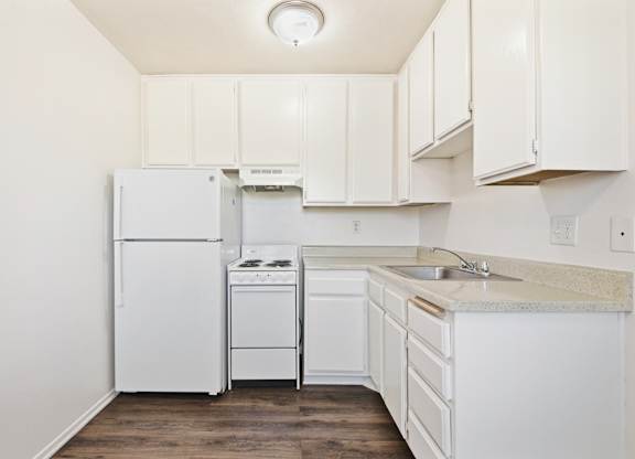 A kitchen with white appliances and cabinets. at Whispering Fountains Diamond Bar, Diamond Bar, 91765
