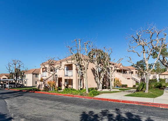 A row of houses with trees in front of them. at Whispering Fountains Diamond Bar, Diamond Bar, CA 91765 