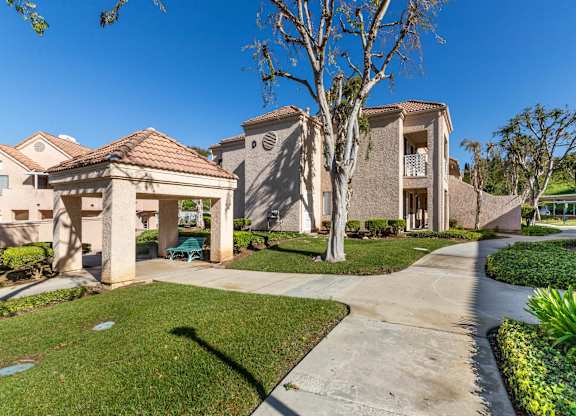 A residential area with houses and a clear sky. at Whispering Fountains Diamond Bar, Diamond Bar, CA 91765