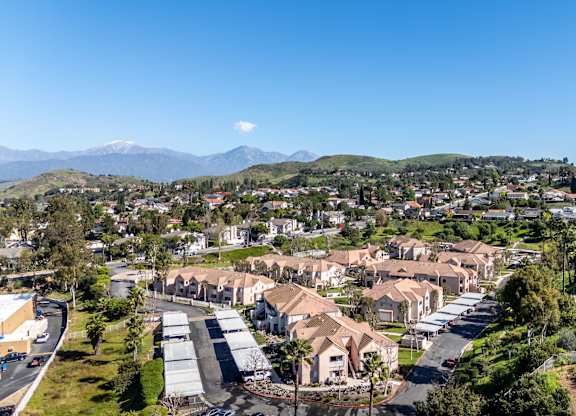 A residential area with houses and a mountain range in the background. at Whispering Fountains Diamond Bar, Diamond Bar California