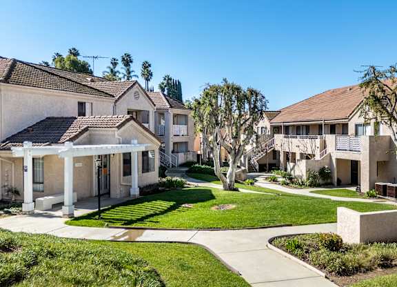 A row of houses with a clear blue sky above them. at Whispering Fountains Diamond Bar, Diamond Bar, CA 91765