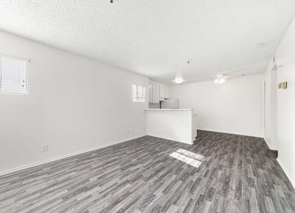A room with a white cabinet and a window with blinds. at Whispering Fountains Lakewood, California, 90805