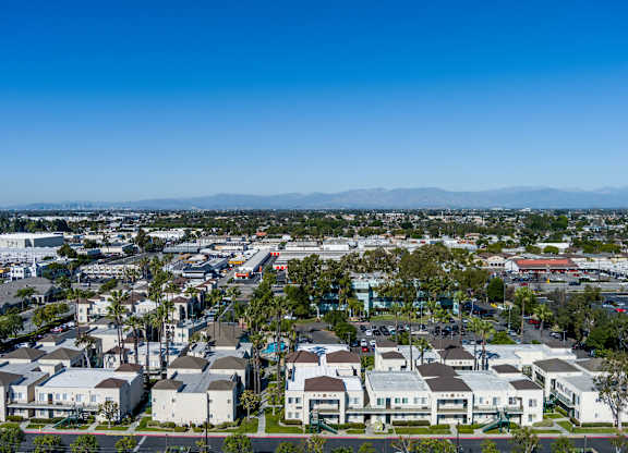 A view of a residential area with houses and buildings. at Whispering Fountains Lakewood, Lakewood Bar, CA