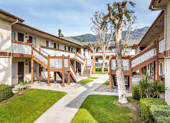 Apartment complex with a tree in the courtyard at Whispering Fountains Monrovia, Monrovia, CA, California , 91016