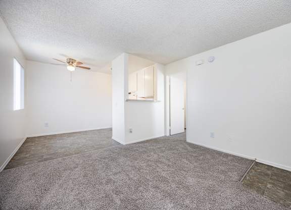Carpeted room with a ceiling fan at Whispering Fountains Monrovia, Monrovia