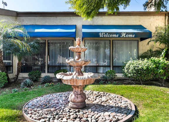 A fountain in the front yard at Whispering Fountains Riverside, Riverside, CA, 92503