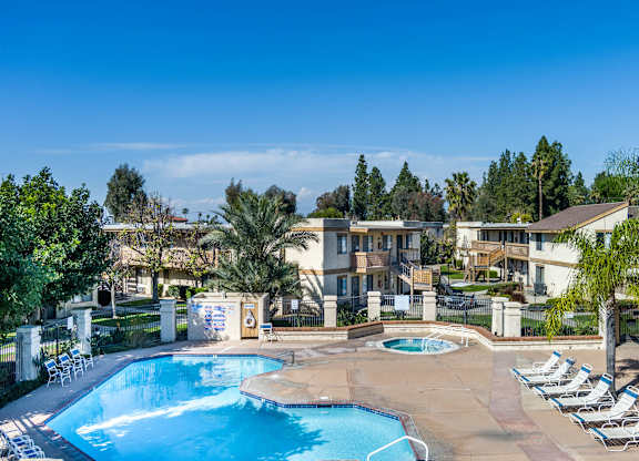 Resort Style Swimming Pool with sundeck at Whispering Fountains Riverside, Riverside, 92503