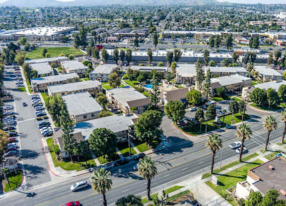 Bird's eye view of a residential area with houses and streets at Whispering Fountains Riverside, Riverside, California 
