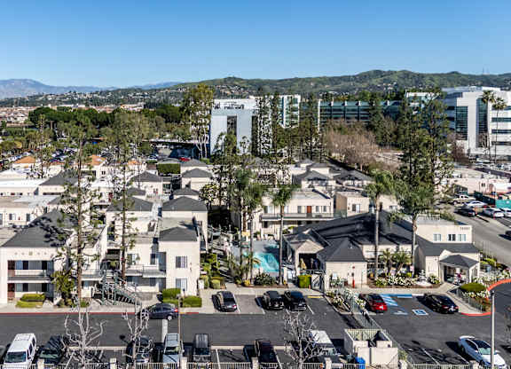 A residential area with houses and parked cars at Whispering Fountains Whittier, Whittier, CA, California