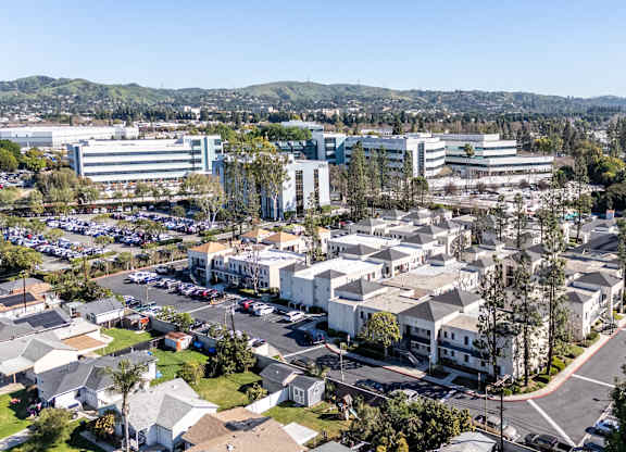 Bird's eye view of a residential area with houses and a parking lot at Whispering Fountains Whittier, Whittier, CA