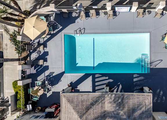 Aerial view of a neighborhood with houses and a swimming pool at Whispering Fountains Whittier, Whittier, CA, California , 90606