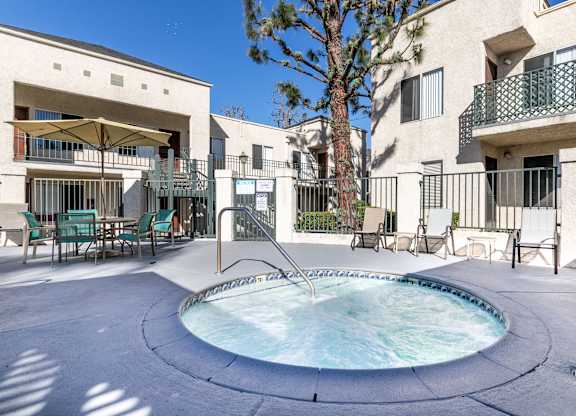 Outdoor hot tub and pool at Whispering Fountains Whittier, Whittier