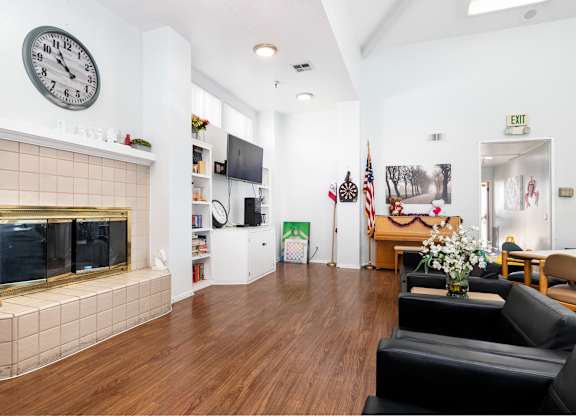 Posh Lounge Area With Fireplace In Clubhouse at Whispering Fountains Whittier, Whittier