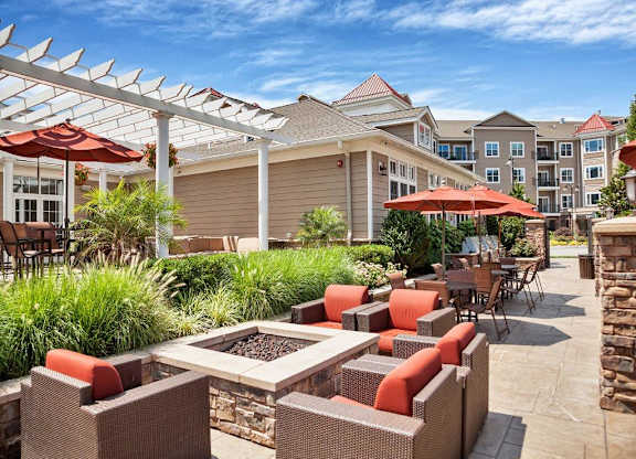 A patio with a table and chairs under a white awning at Vermella Lyndhurst apartments, Lyndhurst, NJ, 07071