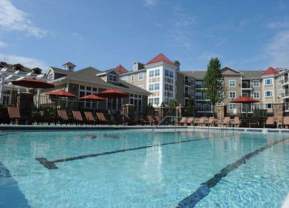 A large swimming pool in front of a resort at Vermella Lyndhurst apartments, New Jersey