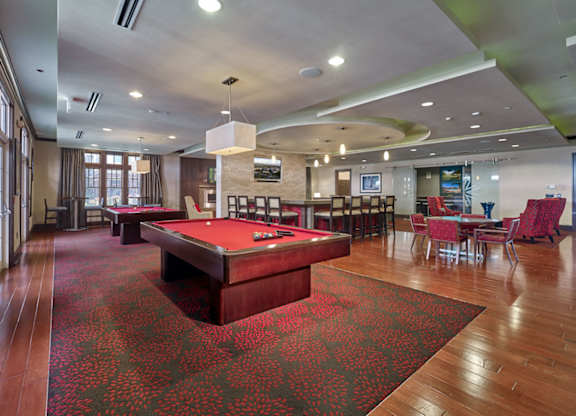 A room with a pool table and a red carpet at Vermella Lyndhurst apartments, Lyndhurst
