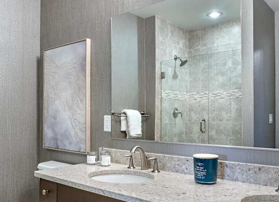 Double sink bathroom with vanity mirror at Vermella Lyndhurst apartments, New Jersey