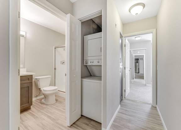 Washer and dryer and hallway at Santee Villas, Santee