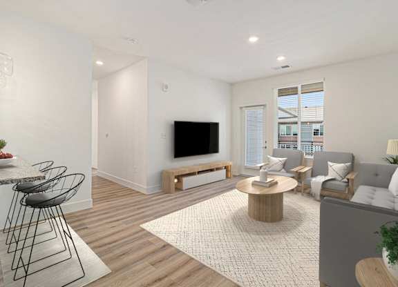 A modern living room with a television, sofas, and a dining table.