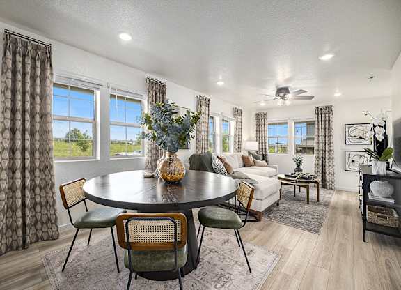 a living room with a table and a couch