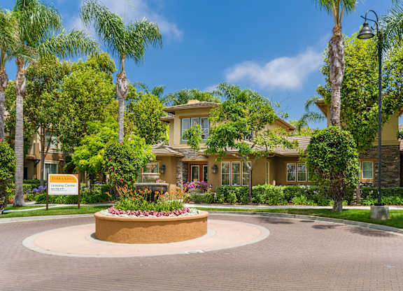 A beautifully landscaped entrance to a residential community.