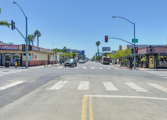a city intersection with a red light at an intersection with cars