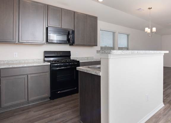 Kitchen Bar With Granite Counter Top at The Village at Caney Mills, Texas, 77303