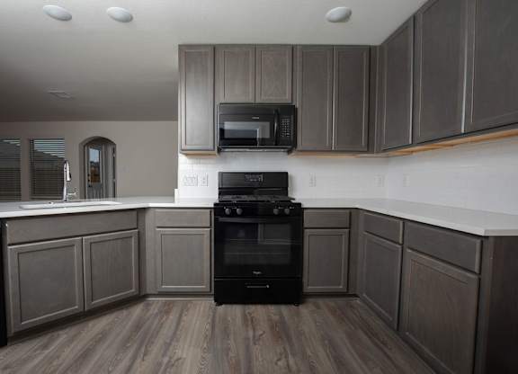 Elegant Backsplashes In Kitchen at The Village at Caney Mills, Texas, 77303