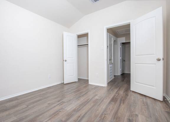 Unfurnished Bedroom And Hallway at The Village at Caney Mills, Conroe, 77303