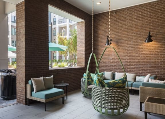 the lobby of a hotel with couches and chairs