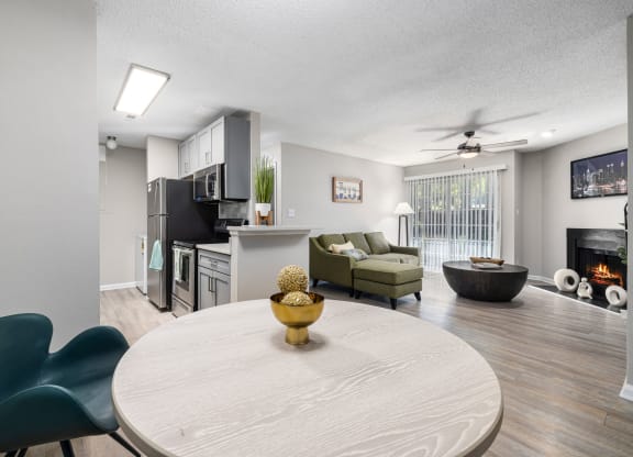 our apartments offer a living room with a dining table and a kitchen at View at Lake Lynn, Raleigh, NC 27613