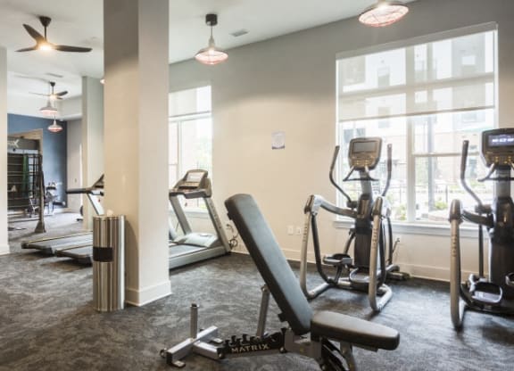 the gym at the district flats apartments in lenexa