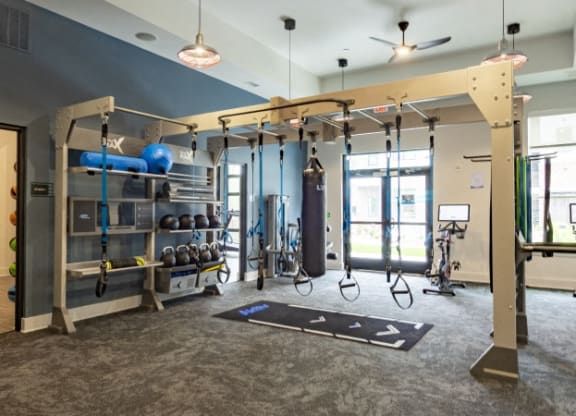 a boxing gym with punching bags and punching bags hanging from the ceiling