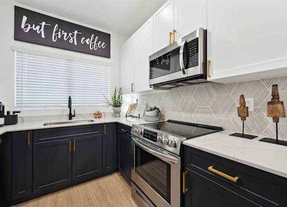 A kitchen with a sign that says