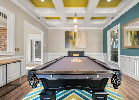 a billiards room with a pool table