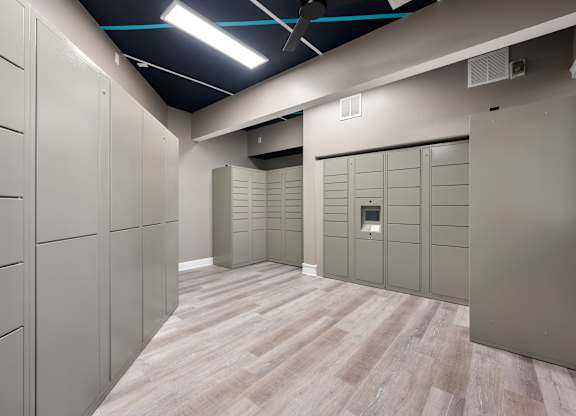 a row of lockers in a room with wood floors