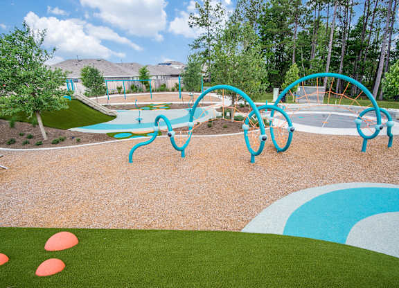 A playground with a blue and white slide.