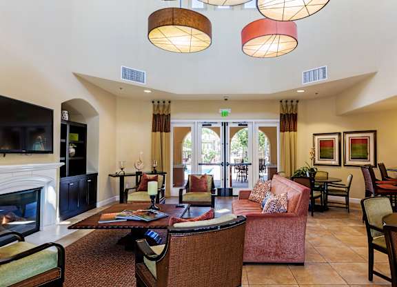 Clubhouse with couches and dining, fireplace