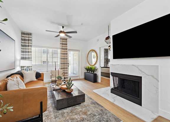 A living room with a fireplace and a couch.
