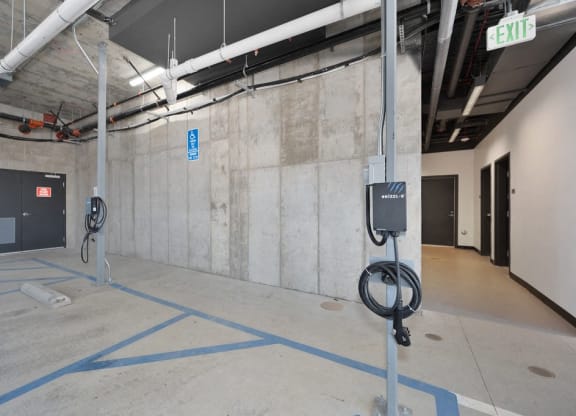 a view of a parking garage with parking meters