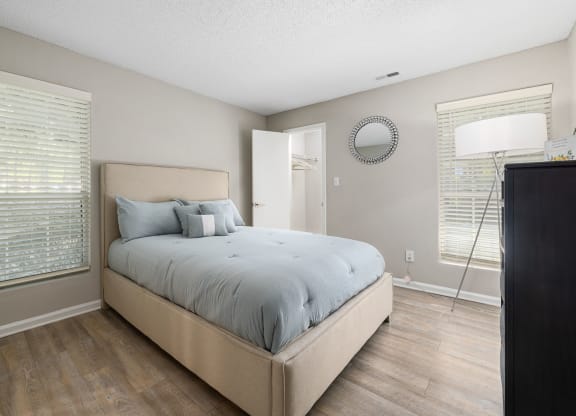 a bedroom with a large bed and a window at View at Lake Lynn, Raleigh, 27613
