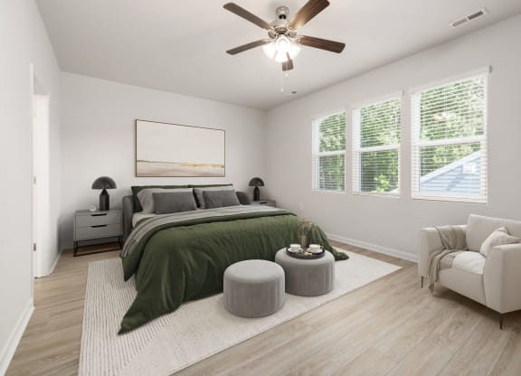 an open bedroom with a bed and a ceiling fan
