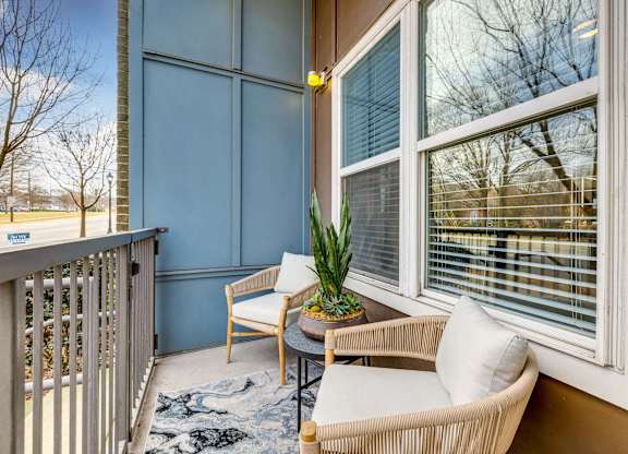 A private balcony with stylish furniture offered at Midtown 205, luxury partments, Charlotte, NC.